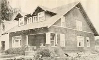 An illustration from The plan book of American dwellings : being a compilation of original home designs, showing actual photographic exteriors and floor plans of moderately priced bungalows, cottages, residences (1914)