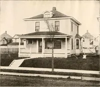 An illustration from The plan book of American dwellings : being a compilation of original home designs, showing actual photographic exteriors and floor plans of moderately priced bungalows, cottages, residences (1914)