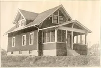An illustration from The plan book of American dwellings : being a compilation of original home designs, showing actual photographic exteriors and floor plans of moderately priced bungalows, cottages, residences (1914)