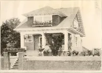 An illustration from The plan book of American dwellings : being a compilation of original home designs, showing actual photographic exteriors and floor plans of moderately priced bungalows, cottages, residences (1914)