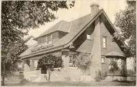 An illustration from The plan book of American dwellings : being a compilation of original home designs, showing actual photographic exteriors and floor plans of moderately priced bungalows, cottages, residences (1914)