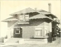 An illustration from The plan book of American dwellings : being a compilation of original home designs, showing actual photographic exteriors and floor plans of moderately priced bungalows, cottages, residences (1914)