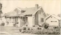 An illustration from The plan book of American dwellings : being a compilation of original home designs, showing actual photographic exteriors and floor plans of moderately priced bungalows, cottages, residences (1914)