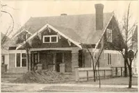 An illustration from The plan book of American dwellings : being a compilation of original home designs, showing actual photographic exteriors and floor plans of moderately priced bungalows, cottages, residences (1914)