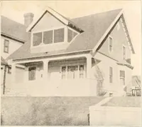 An illustration from The plan book of American dwellings : being a compilation of original home designs, showing actual photographic exteriors and floor plans of moderately priced bungalows, cottages, residences (1914)