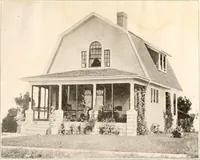 An illustration from The plan book of American dwellings : being a compilation of original home designs, showing actual photographic exteriors and floor plans of moderately priced bungalows, cottages, residences (1914)