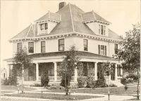 An illustration from The plan book of American dwellings : being a compilation of original home designs, showing actual photographic exteriors and floor plans of moderately priced bungalows, cottages, residences (1914)
