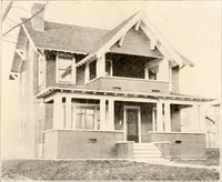An illustration from The plan book of American dwellings : being a compilation of original home designs, showing actual photographic exteriors and floor plans of moderately priced bungalows, cottages, residences (1914)