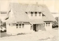 An illustration from The plan book of American dwellings : being a compilation of original home designs, showing actual photographic exteriors and floor plans of moderately priced bungalows, cottages, residences (1914)