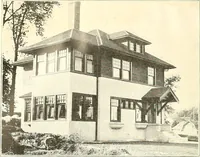 An illustration from The plan book of American dwellings : being a compilation of original home designs, showing actual photographic exteriors and floor plans of moderately priced bungalows, cottages, residences (1914)