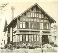 An illustration from The plan book of American dwellings : being a compilation of original home designs, showing actual photographic exteriors and floor plans of moderately priced bungalows, cottages, residences (1914)