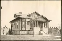 An illustration from The plan book of American dwellings : being a compilation of original home designs, showing actual photographic exteriors and floor plans of moderately priced bungalows, cottages, residences (1914)