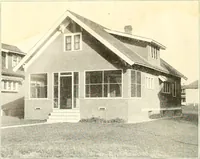 An illustration from The plan book of American dwellings : being a compilation of original home designs, showing actual photographic exteriors and floor plans of moderately priced bungalows, cottages, residences (1914)