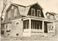 An illustration from The plan book of American dwellings : being a compilation of original home designs, showing actual photographic exteriors and floor plans of moderately priced bungalows, cottages, residences (1914)