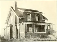 An illustration from The plan book of American dwellings : being a compilation of original home designs, showing actual photographic exteriors and floor plans of moderately priced bungalows, cottages, residences (1914)