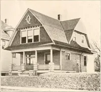 An illustration from The plan book of American dwellings : being a compilation of original home designs, showing actual photographic exteriors and floor plans of moderately priced bungalows, cottages, residences (1914)