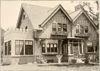 An illustration from The plan book of American dwellings : being a compilation of original home designs, showing actual photographic exteriors and floor plans of moderately priced bungalows, cottages, residences (1914)