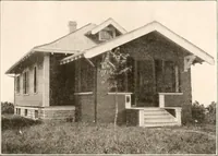 An illustration from The plan book of American dwellings : being a compilation of original home designs, showing actual photographic exteriors and floor plans of moderately priced bungalows, cottages, residences (1914)