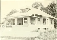 An illustration from The plan book of American dwellings : being a compilation of original home designs, showing actual photographic exteriors and floor plans of moderately priced bungalows, cottages, residences (1914)