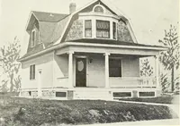 An illustration from The plan book of American dwellings : being a compilation of original home designs, showing actual photographic exteriors and floor plans of moderately priced bungalows, cottages, residences (1914)