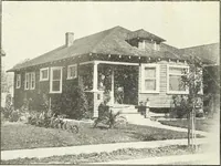 An illustration from The plan book of American dwellings : being a compilation of original home designs, showing actual photographic exteriors and floor plans of moderately priced bungalows, cottages, residences (1914)