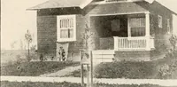 An illustration from The plan book of American dwellings : being a compilation of original home designs, showing actual photographic exteriors and floor plans of moderately priced bungalows, cottages, residences (1914)