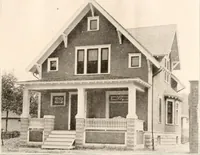 An illustration from The plan book of American dwellings : being a compilation of original home designs, showing actual photographic exteriors and floor plans of moderately priced bungalows, cottages, residences (1914)