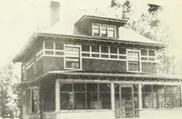 An illustration from The plan book of American dwellings : being a compilation of original home designs, showing actual photographic exteriors and floor plans of moderately priced bungalows, cottages, residences (1914)