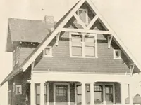 An illustration from The plan book of American dwellings : being a compilation of original home designs, showing actual photographic exteriors and floor plans of moderately priced bungalows, cottages, residences (1914)
