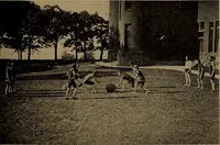 An illustration from Play, comprising games for the kindergarten, playground, schoolroom and college; how to coach and play girls' basket-ball, etc (1912)