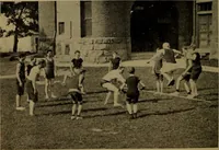An illustration from Play, comprising games for the kindergarten, playground, schoolroom and college; how to coach and play girls' basket-ball, etc (1912)