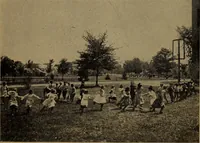 An illustration from Play, comprising games for the kindergarten, playground, schoolroom and college; how to coach and play girls' basket-ball, etc (1912)