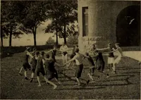 An illustration from Play, comprising games for the kindergarten, playground, schoolroom and college; how to coach and play girls' basket-ball, etc (1912)
