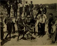 An illustration from Play, comprising games for the kindergarten, playground, schoolroom and college; how to coach and play girls' basket-ball, etc (1912)