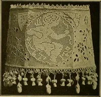 An illustration from The Priscilla filet crochet book, no. 2 ; a collection of beautiful designs in filet crochet, introducing filet crochet brodé, embroidery on crochet and cameo crochet (1914)