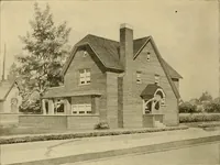 An illustration from Radford's brick houses and how to build them : a standard collection of new, original, and artistic designs for brick houses, apartments, stores and flats, garages, etc. ; together with complete instruction in the manufacture of brick and its practical uses as a building material selected and compiled by William A. Radford ... Every plan designed and executed by a corps of licensed architects of the highest professional standing, assisted by a staff of expert draftsmen. Over 300 designs and details. (1912)