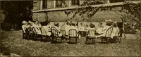 An illustration from Rhythmic action plays and dances; a book of original games and dances, arranged progressively, to Mother Goose and other action songs, with a teaching introductory; for the kindergarten, primary schools, playground and gymnasium (1915)