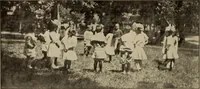An illustration from Rhythmic action plays and dances; a book of original games and dances, arranged progressively, to Mother Goose and other action songs, with a teaching introductory; for the kindergarten, primary schools, playground and gymnasium (1915)