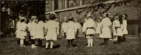 An illustration from Rhythmic action plays and dances; a book of original games and dances, arranged progressively, to Mother Goose and other action songs, with a teaching introductory; for the kindergarten, primary schools, playground and gymnasium (1915)